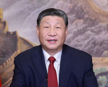 31日、テレビ演説で新年のメッセージを伝える中国の習近平国家主席(EPA時事)