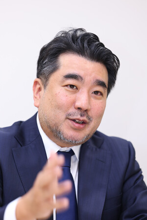インタビューに答える、ありあけキャピタルの田中克典代表＝２３日、東京都中央区
